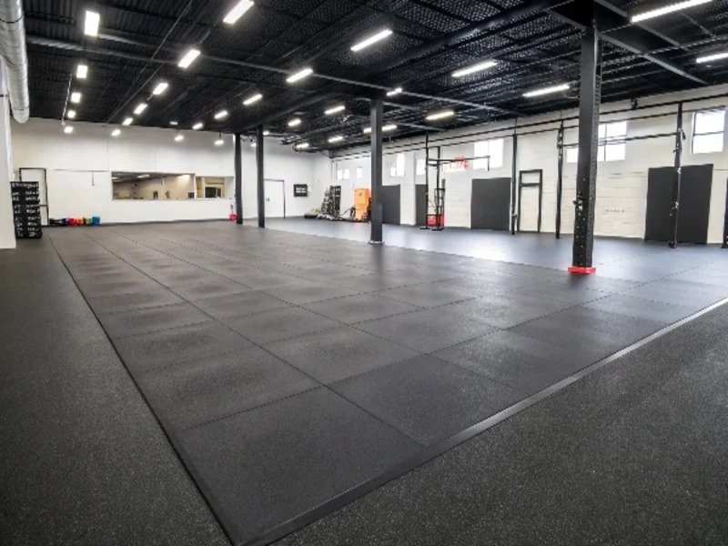 A Minimalist Pure Black Rubber Gym Floor In A Mod[1]