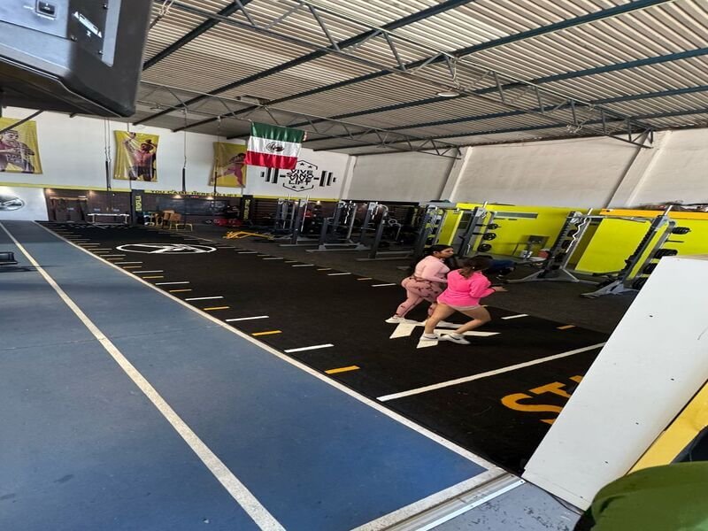 Group fitness class on artificial grass gym flooring