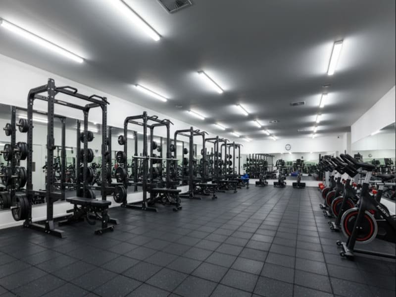 CrossFit athletes lifting weights on rubber flooring