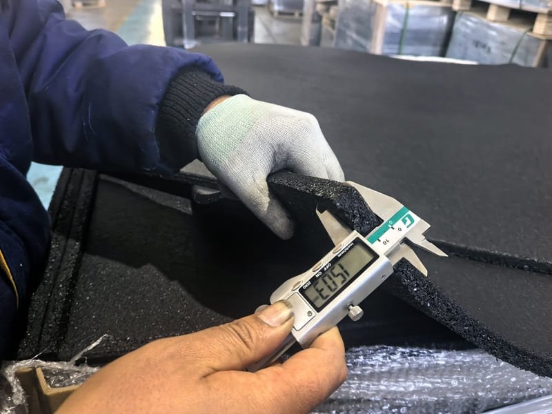 Close-up cross section comparing high density tightly packed granules vs low density loose granules